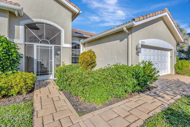 view of side of property with a garage