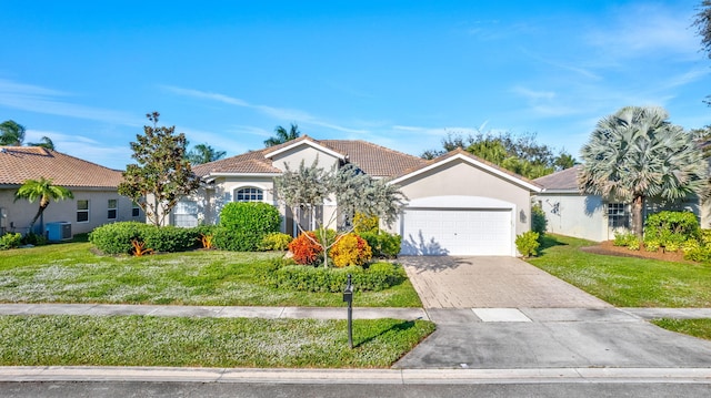 view of front of property with a garage, central air condition unit, and a front lawn