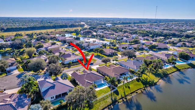 birds eye view of property featuring a water view