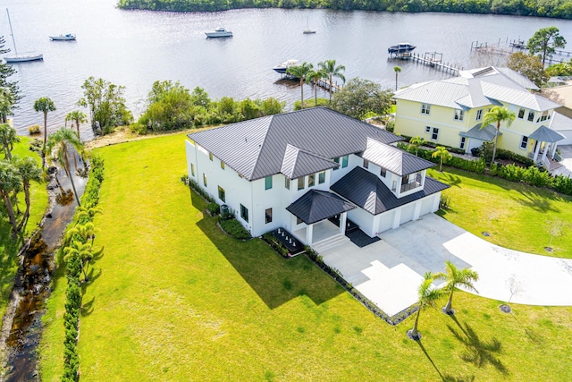 birds eye view of property with a water view