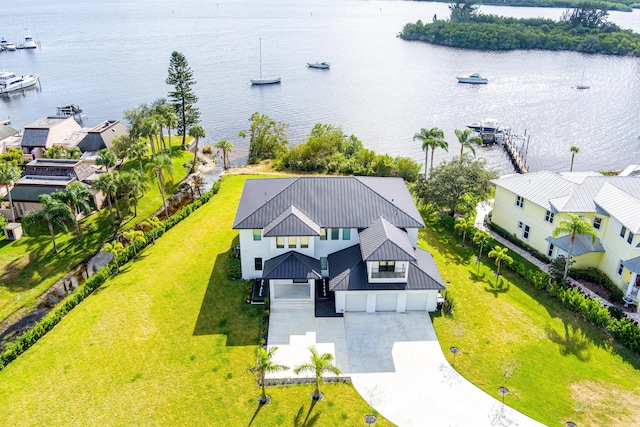 birds eye view of property with a water view