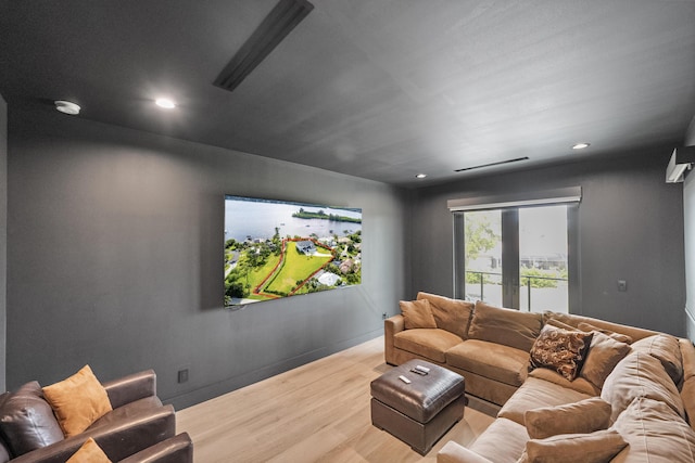 living room with hardwood / wood-style floors and french doors