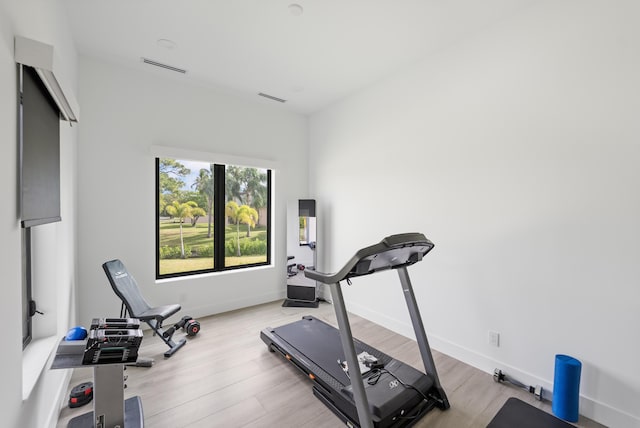 workout room with light wood-type flooring