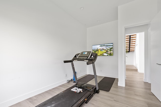 workout area featuring light hardwood / wood-style floors