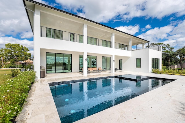 rear view of house with a patio