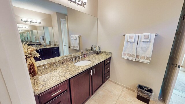 bathroom with tile patterned floors and vanity