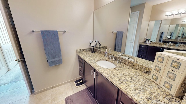 bathroom with tile patterned flooring and vanity