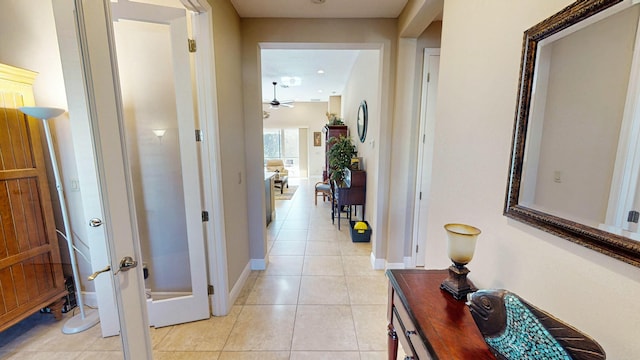 hallway featuring light tile patterned floors