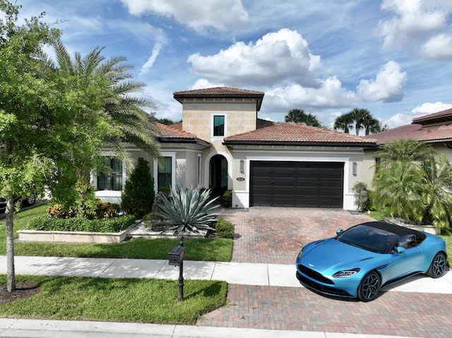 mediterranean / spanish house with a garage