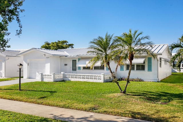 single story home featuring a front yard and a garage