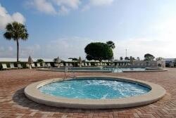 view of swimming pool with a jacuzzi