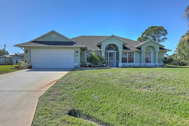 single story home with a garage and a front lawn