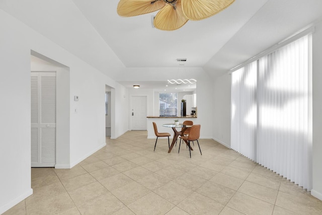 dining area featuring ceiling fan and light tile patterned flooring