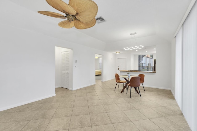 dining area with ceiling fan and light tile patterned flooring