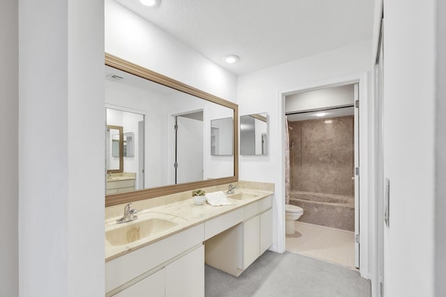 full bathroom featuring vanity, tile patterned flooring, tiled shower / bath combo, toilet, and a textured ceiling