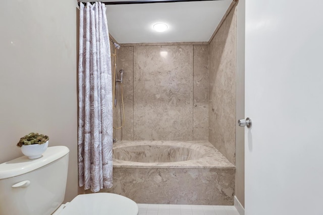 bathroom featuring tile patterned flooring, shower / tub combo, and toilet