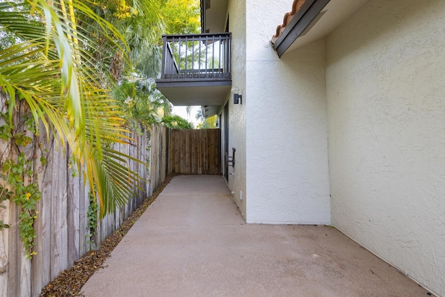 view of side of home with a balcony