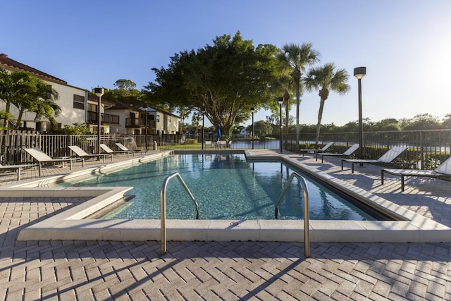 view of swimming pool with a patio area