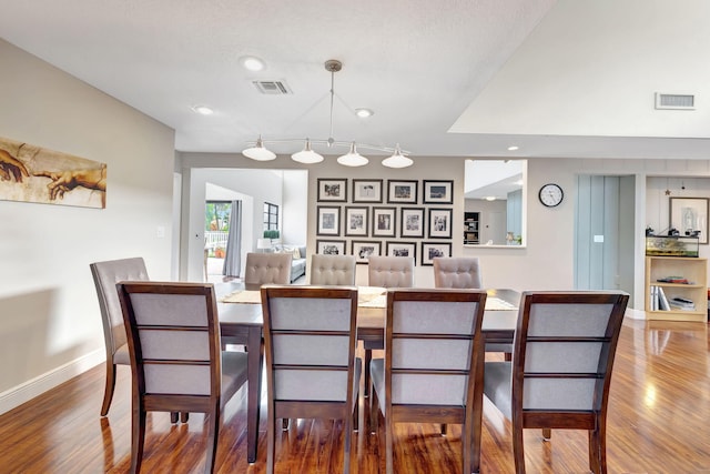 dining room with hardwood / wood-style flooring