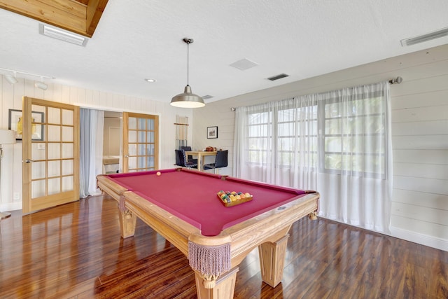 recreation room featuring dark hardwood / wood-style flooring, a textured ceiling, pool table, and french doors