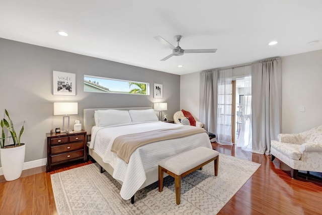 bedroom with hardwood / wood-style floors and ceiling fan