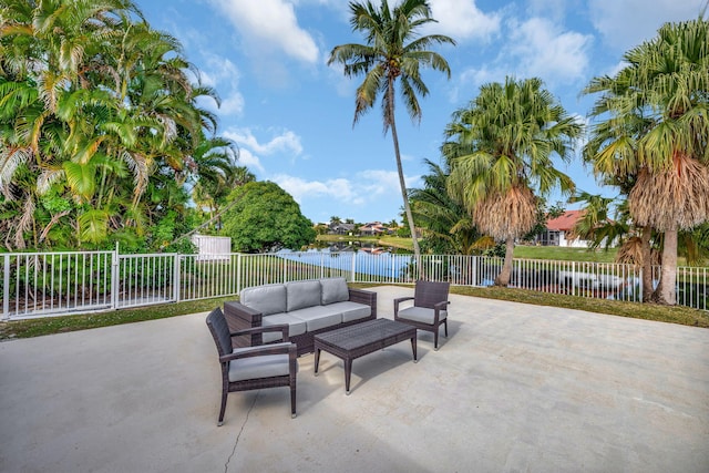 view of patio / terrace with an outdoor living space and a water view