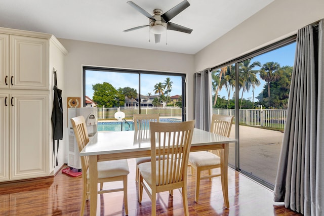 dining space featuring light wood-type flooring and ceiling fan