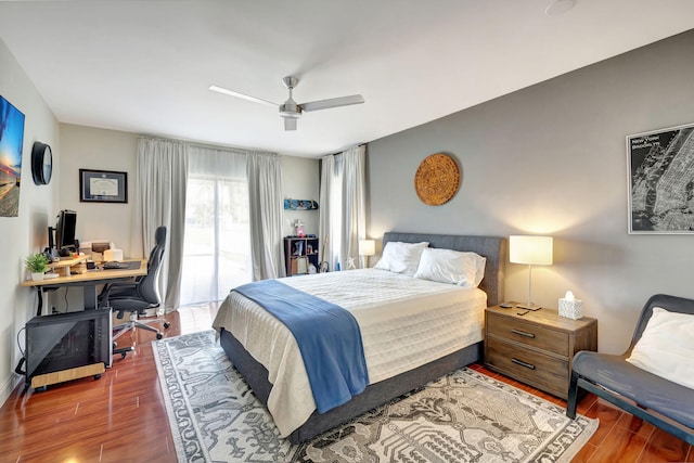 bedroom featuring access to exterior, hardwood / wood-style floors, and ceiling fan