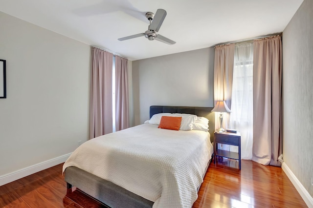 bedroom featuring hardwood / wood-style flooring and ceiling fan