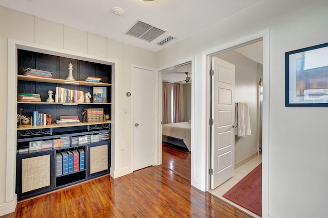 hall with hardwood / wood-style floors