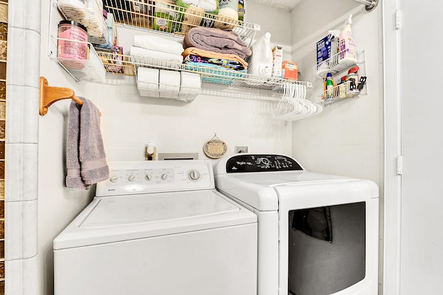 laundry room with washing machine and dryer