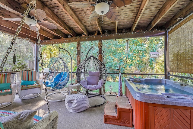 view of patio with a hot tub and ceiling fan