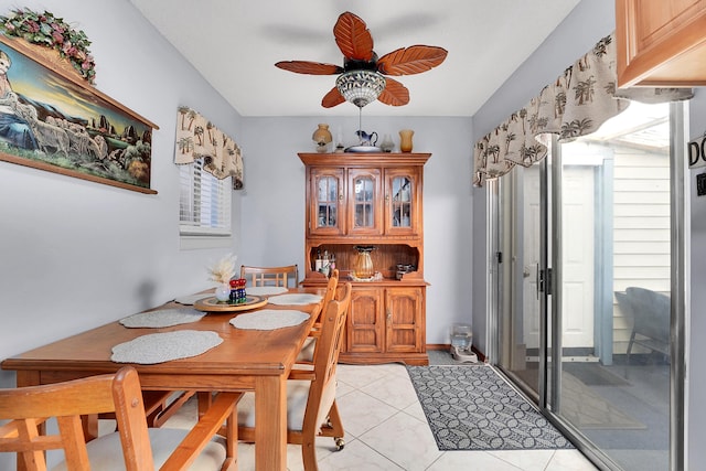 tiled dining area featuring plenty of natural light and ceiling fan