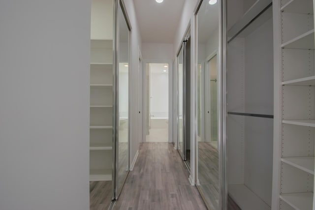 corridor with wood finished floors