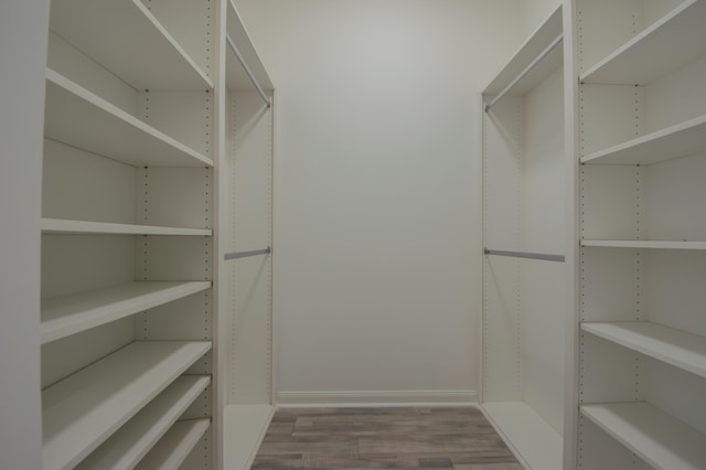 spacious closet with wood finished floors