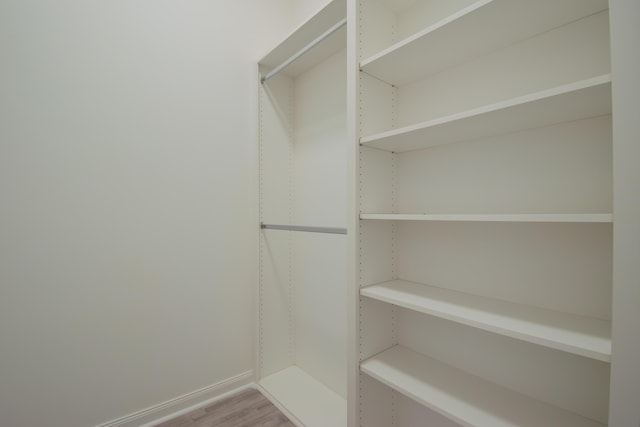 spacious closet with wood finished floors