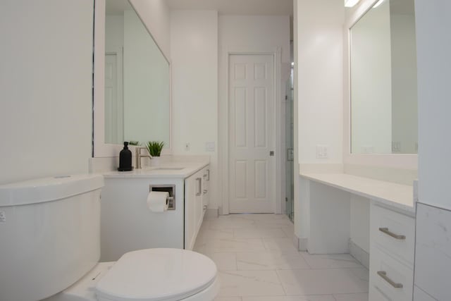 full bath featuring toilet, marble finish floor, a shower with door, and vanity