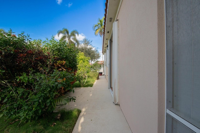 view of side of property with stucco siding