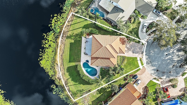 birds eye view of property featuring a water view