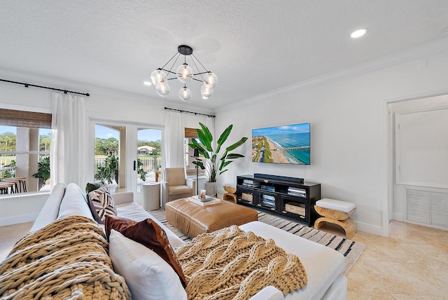 tiled living room featuring french doors, a textured ceiling, ornamental molding, and a notable chandelier