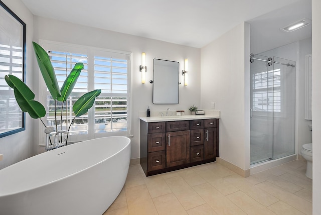 full bathroom with tile patterned flooring, vanity, toilet, and independent shower and bath