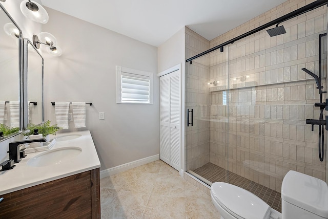 bathroom featuring an enclosed shower, vanity, toilet, and tile patterned floors