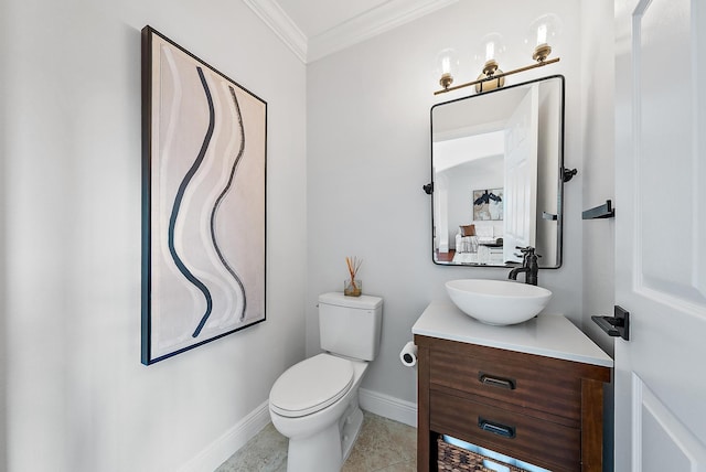 bathroom featuring tile patterned flooring, toilet, vanity, and ornamental molding