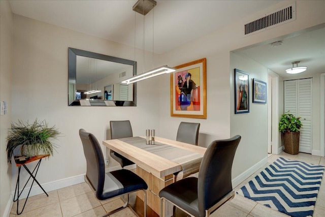 dining room with light tile patterned flooring