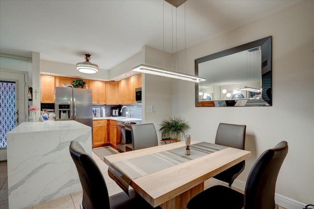 tiled dining area with sink