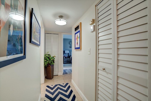 hall featuring light tile patterned flooring