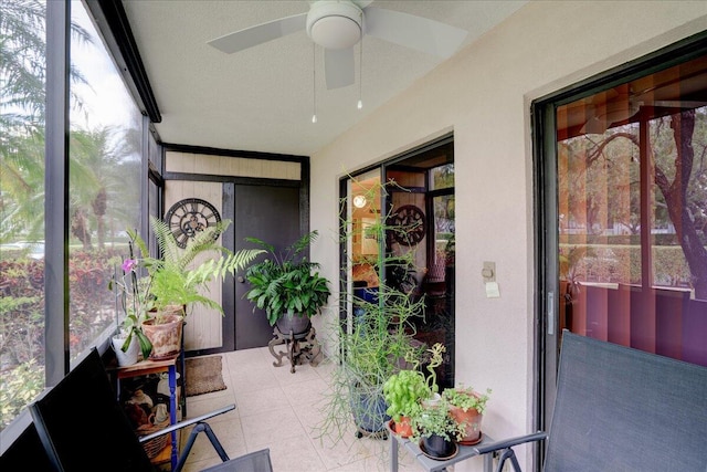 sunroom / solarium with a wealth of natural light and ceiling fan