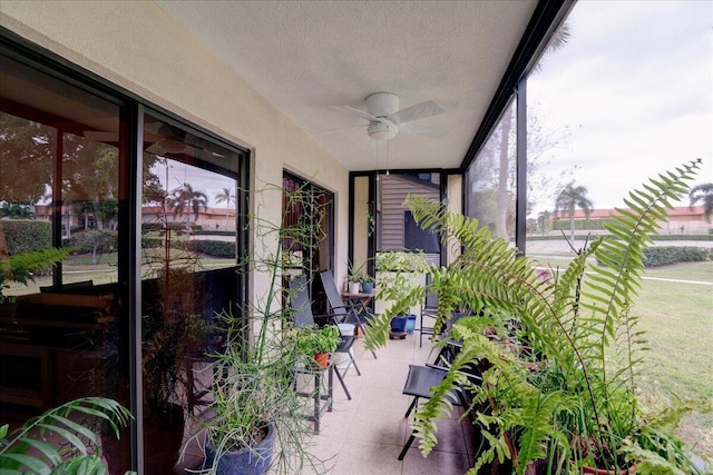 sunroom with a wealth of natural light and ceiling fan