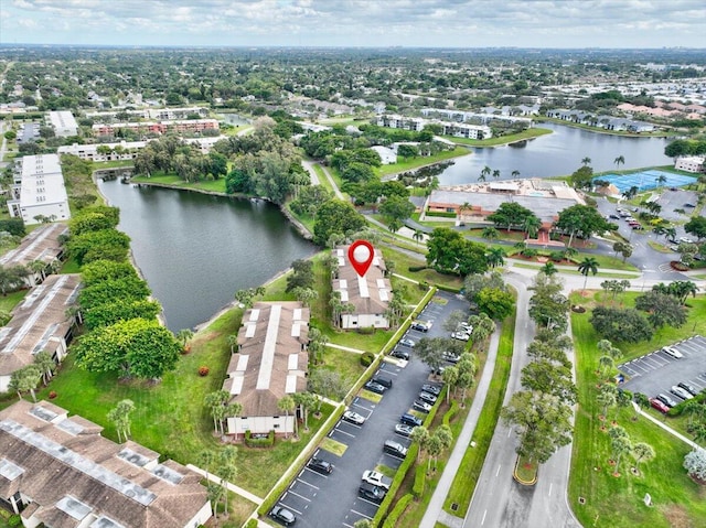 birds eye view of property featuring a water view