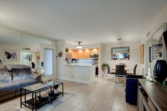 living room with light tile patterned flooring